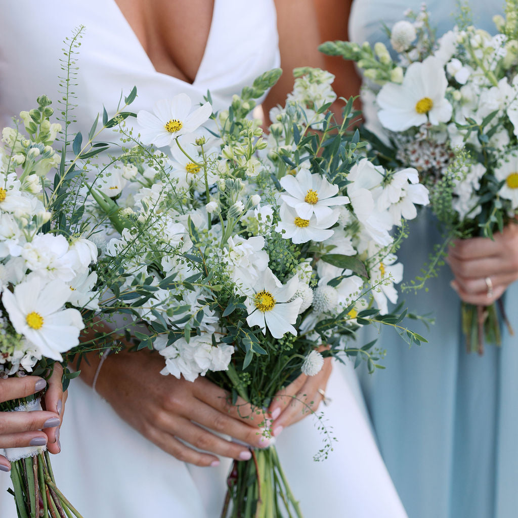 Bridesmaids holding white and green bouquets, styled for a bridal expo and wedding inspiration event in Monmouth County NJ